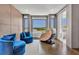 Inviting sitting area boasts plush seating, natural light, and scenic views, creating a relaxing space at 7613 Toscana Blvd, Orlando, FL 32819