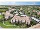 Scenic aerial view of the community showcasing manicured landscaping, parking, and residential buildings at 8296 Portofino Dr # 103, Davenport, FL 33896