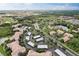 Overhead view of a condo community featuring covered parking, a pool, and a pond at 8296 Portofino Dr # 103, Davenport, FL 33896
