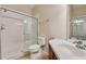 Bathroom showcasing a tile shower, toilet, and vanity at 8296 Portofino Dr # 103, Davenport, FL 33896
