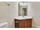 Bathroom featuring a corner sink with wood cabinetry at 8296 Portofino Dr # 103, Davenport, FL 33896