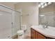 Bathroom with a glass-enclosed shower and single sink vanity at 8296 Portofino Dr # 103, Davenport, FL 33896