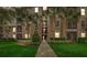 Exterior view of a condo building with palm trees and landscaped walkway at 8296 Portofino Dr # 103, Davenport, FL 33896