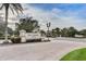 The Ventura at Bella Trae community entrance featuring lush landscaping, manicured lawns, and decorative signage at 8296 Portofino Dr # 103, Davenport, FL 33896
