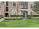 Attractive condo exterior with lawn, landscaping, and palm trees at 8296 Portofino Dr # 103, Davenport, FL 33896