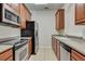 An upgraded kitchen with stainless steel appliances and modern countertops at 8296 Portofino Dr # 103, Davenport, FL 33896