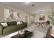 Staged living room, dining room and kitchen area at 8296 Portofino Dr # 103, Davenport, FL 33896