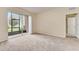 This large living room features a sliding glass door to the outdoor space at 8296 Portofino Dr # 103, Davenport, FL 33896