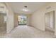 The living room offers neutral walls, carpeting and archways to the bedroom and outdoor space at 8296 Portofino Dr # 103, Davenport, FL 33896