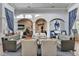 A sunlit lobby with comfortable seating and arched doorways offers a relaxing communal space at 8296 Portofino Dr # 103, Davenport, FL 33896
