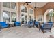 Comfortable community lounge with plush seating, ceiling fans, and an inviting atmosphere for residents at 8296 Portofino Dr # 103, Davenport, FL 33896