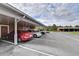 Convenient covered parking area with multiple spaces and easy access to residential buildings and amenities at 8296 Portofino Dr # 103, Davenport, FL 33896