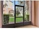 Screened-in patio provides views of the fountain, landscaping and apartment building at 8296 Portofino Dr # 103, Davenport, FL 33896