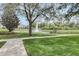 Pond with fountain, surrounded by grass and walking path at 8296 Portofino Dr # 103, Davenport, FL 33896