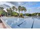Beautiful swimming pool with mature palm trees, landscaping, and seating areas for relaxation and recreation at 8296 Portofino Dr # 103, Davenport, FL 33896