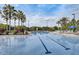 Sparkling swimming pool with marked lanes, surrounded by lush landscaping and sunny lounge areas at 8296 Portofino Dr # 103, Davenport, FL 33896