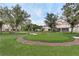 Putting green in community with lush lawn and trees at 8296 Portofino Dr # 103, Davenport, FL 33896