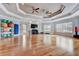 A spacious yoga room with hardwood floors features two ceiling fans and a rack of exercise balls at 8296 Portofino Dr # 103, Davenport, FL 33896