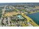 The community aerial view shows the pool, tennis courts, lake and extensive residential development at 8972 Sonoma Coast Dr, Winter Garden, FL 34787