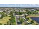 This aerial showcases the community's layout, landscaping, and lake at 8972 Sonoma Coast Dr, Winter Garden, FL 34787