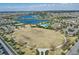 Aerial shot showcases the community's central green, lake, pool, tennis courts and surrounding residences at 8972 Sonoma Coast Dr, Winter Garden, FL 34787