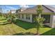 A well-manicured lawn, complemented by young trees, is perfect for outdoor relaxation at 8972 Sonoma Coast Dr, Winter Garden, FL 34787