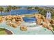 Beautiful cascading fountain with rock features and lake views within the Waterleigh community at 8972 Sonoma Coast Dr, Winter Garden, FL 34787