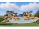 Stunning fountain at Waterleigh entrance with a blue tiled waterfall and stone accents at 8972 Sonoma Coast Dr, Winter Garden, FL 34787