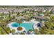 A top down view of the community pool, outdoor furniture and lounging area at 8972 Sonoma Coast Dr, Winter Garden, FL 34787
