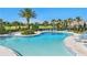 Resort-style community pool with ample lounge chairs and lush landscaping, creating a relaxing oasis at 8972 Sonoma Coast Dr, Winter Garden, FL 34787