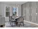Dining room with contemporary furniture, a decorative wall, and natural light from the windows at 8972 Sonoma Coast Dr, Winter Garden, FL 34787