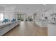 Open-concept living space with modern decor, light-colored walls, floor-to-ceiling windows and direct access to other rooms at 8972 Sonoma Coast Dr, Winter Garden, FL 34787