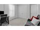 A spacious office space with a modern desk, comfortable seating, white decor, and ample natural light at 8972 Sonoma Coast Dr, Winter Garden, FL 34787