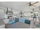 Spacious outdoor kitchen and dining area, perfect for entertaining, featuring modern appliances at 8972 Sonoma Coast Dr, Winter Garden, FL 34787