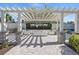 Stylish outdoor lounge area with a pergola, offering a comfortable space for community gatherings at 8972 Sonoma Coast Dr, Winter Garden, FL 34787