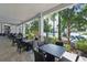 Shaded outdoor patio with comfortable seating and lush landscaping, ideal for relaxation at 8972 Sonoma Coast Dr, Winter Garden, FL 34787