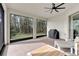 Cozy screened patio with a view of the backyard, ceiling fan and outdoor furniture and barbecue at 8972 Sonoma Coast Dr, Winter Garden, FL 34787