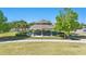 Community pavilion, with picnic tables, surrounded by mature trees and lush landscaping at 8972 Sonoma Coast Dr, Winter Garden, FL 34787