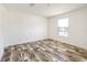 Bedroom features wood look flooring, window, and base molding at 9055 Atlas Dr, St Cloud, FL 34773