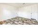Bedroom features wood look flooring, base molding, and two closets at 9055 Atlas Dr, St Cloud, FL 34773