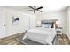 Cozy bedroom with modern flooring, neutral decor, and a comfortable bed setting a relaxing ambiance at 9055 Atlas Dr, St Cloud, FL 34773