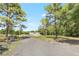 Scenic view of a charming home nestled among lush trees and greenery at 9055 Atlas Dr, St Cloud, FL 34773