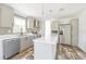 Stylish kitchen with gray cabinets, stainless steel appliances, and white countertops at 9055 Atlas Dr, St Cloud, FL 34773