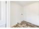 The laundry room features wood-look vinyl floors and white walls at 9055 Atlas Dr, St Cloud, FL 34773