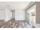 Bright living room with sliding doors and luxury vinyl flooring at 9055 Atlas Dr, St Cloud, FL 34773