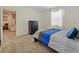 Bedroom with a plush bed, soft carpets, a window and a black dresser at 9084 Sommerset Hills Dr, Davenport, FL 33896
