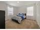 Bedroom featuring soft carpet, neutral walls, black dresser, and sun-filled windows at 9084 Sommerset Hills Dr, Davenport, FL 33896