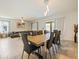 Inviting dining area with a large table, sliding doors, and seamless access to the living space, perfect for gatherings at 9084 Sommerset Hills Dr, Davenport, FL 33896