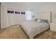 This bedroom features carpet, a modern headboard, decorative art and a large window at 9084 Sommerset Hills Dr, Davenport, FL 33896