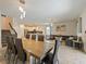 Bright and airy living space with a dining table, open kitchen, and comfortable seating area at 9084 Sommerset Hills Dr, Davenport, FL 33896